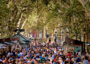 Barcelona, Spain - August 14, 2023: Barcelona's main "Rambla" is the city's most crowded walking promenade