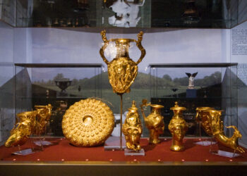 The Panagyurishte Treasure (?????????? ?????? ?????????) is a Thracian treasure discovered in 1949 two kilometres south of the town of Panagyurishte, Bulgaria. It consists of nine gold vessels (a phiale, an amphora and seven rhytons) with total weight of 6.164 kg of 23-karat gold. All of the objects are richly and skilfully decorated with scenes of Thracian myths, customs and life. The treasure is dated to the 4th-3rd centuries BC, and is thought to have been used as a royal ceremonial set, possibly by a Thracian kings.  The big amphora has handles shaped as centaurs, and the openings for pouring wine represent Negro heads.  Inbetween those two opinings, the amphora is decorated with a scene of Hercules fighting a snake. Three of the seven rhytons are jugs with Amazon heads and carry scenes and heroes from Greek mythology, and the phiale carries inscriptions giving its weight in Greek drachmae and Persian darics. 
As one of the best known surviving artifacts of Thracian culture, the treasure has been displayed at various museums around the world. When not on a tour, the treasure is the centerpiece of the Thracian art collection of the National Museum of History in Sofia.