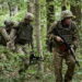 epa11491826 Ukrainian servicemen of the 3rd Brigade of Operational Assignment 'Spartan' attend their tactical training with storming and clearing positions, evacuating the wounded, and the first medical aid at an undisclosed place, amid the Russian invasion in Kharkiv's area, northeastern Ukraine, 22 July 2024. Russian troops entered Ukrainian territory on 24 February 2022, starting a conflict that has provoked destruction and a humanitarian crisis.  EPA/SERGEY KOZLOV