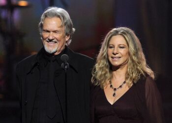 LOS ANGELES, CA - FEBRUARY 13:  Singers Kris Kristofferson (L) and Barbra Streisand speak onstage during The 53rd Annual GRAMMY Awards held at Staples Center on February 13, 2011 in Los Angeles, California.  (Photo by Kevin Winter/Getty Images)