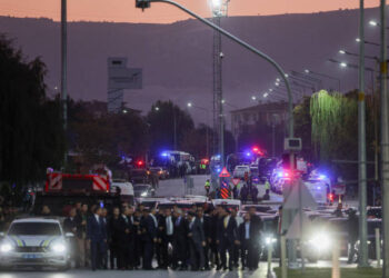 ANKARA, TURKEY - OCTOBER 23: Police and emergency services are seen on the road at the entrance of the Turkish Aerospace Industries facility after an attack on October 23, 2024 in Ankara, Turkey. Turkish President Regip Tayyip Erdogan announced that four people had been killed and fourteen wounded in the attack that was conducted by two assailants that were killed during the attack, as yet, no organization has claimed responsibility for the attack. (Photo by Serdar Ozsoy/Getty Images)