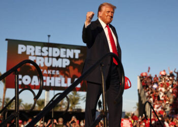 COACHELLA, CALIFORNIA - OCTOBER 12: Republican presidential nominee, former U.S. President Donald Trump gestures while walking onstage for a campaign rally on October 12, 2024 in Coachella, California. With 24 days to go until election day, former President Donald Trump is detouring from swing states to hold the rally in Democratic presidential nominee, Vice President Kamala Harris' home state. (Photo by Mario Tama/Getty Images)