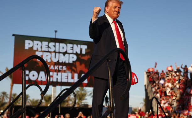 COACHELLA, CALIFORNIA - OCTOBER 12: Republican presidential nominee, former U.S. President Donald Trump gestures while walking onstage for a campaign rally on October 12, 2024 in Coachella, California. With 24 days to go until election day, former President Donald Trump is detouring from swing states to hold the rally in Democratic presidential nominee, Vice President Kamala Harris' home state. (Photo by Mario Tama/Getty Images)