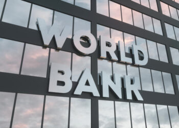 World Bank sign on a modern glass skyscraper. World Bank glass building. 3d rendering.