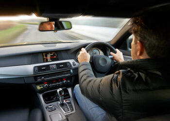 man driving car