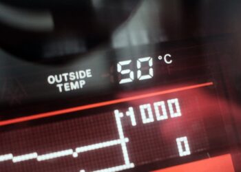 A dashboard display shows an external temperatue of 50 degrees celsius outside a vehicle in Dubai on May 23, 2025. (Photo by Giuseppe CACACE / AFP)